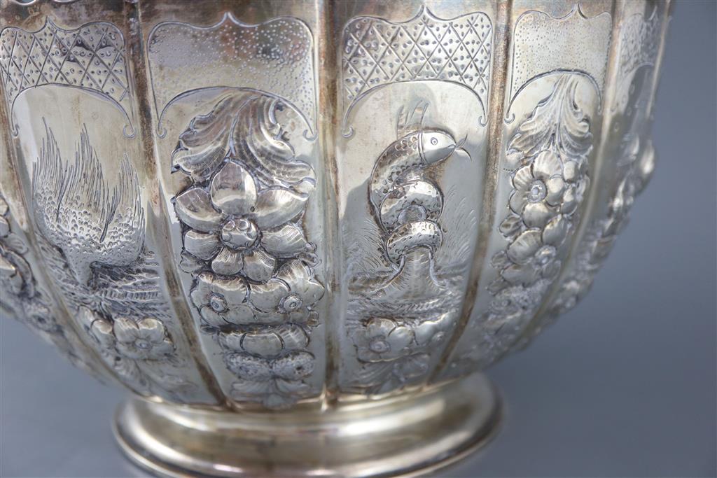 A late Victorian embossed silver presentation punch bowl, by Thomas of New Bond Street, London, 1890,